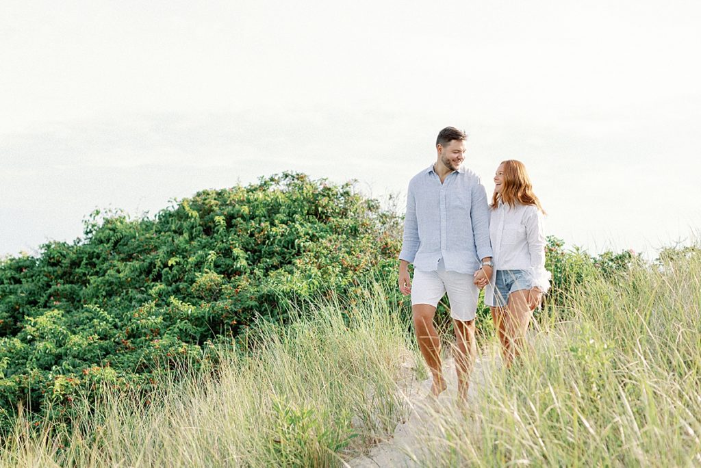 Couple walking at Napatree Point in Watch Hill
