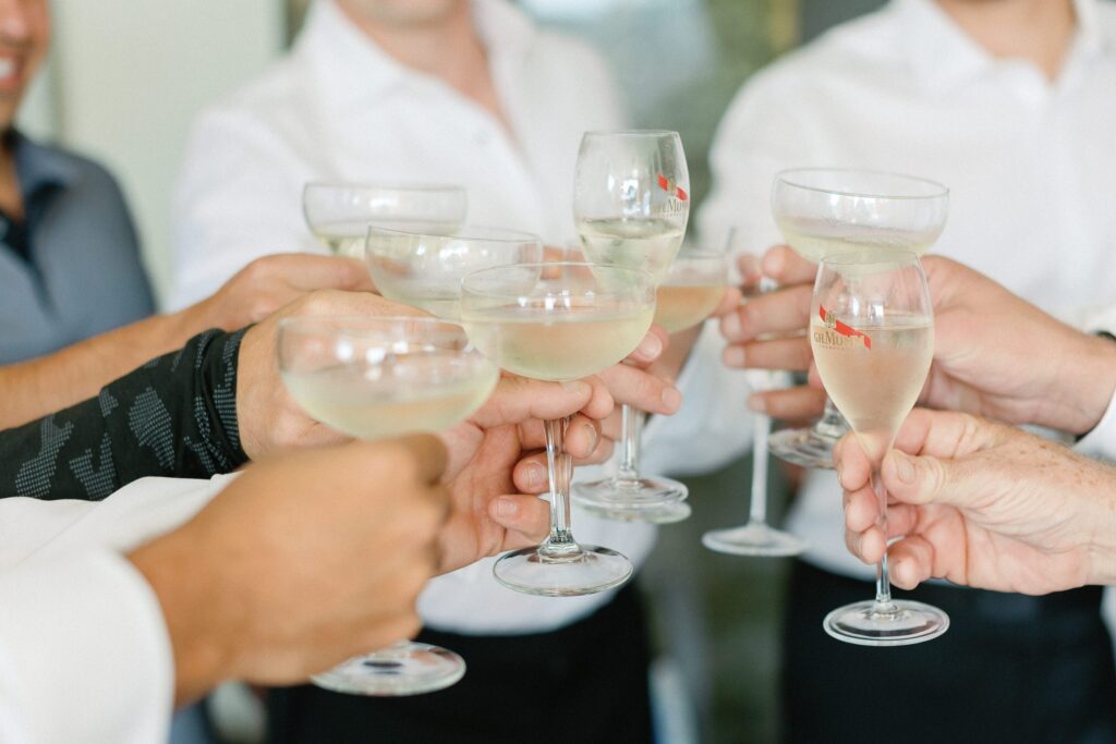 Groom and groomsment cheers before wedding
