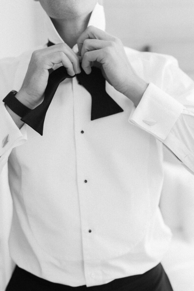 Groom putting on tux for Institute of Contemporary a Boston Museum Wedding