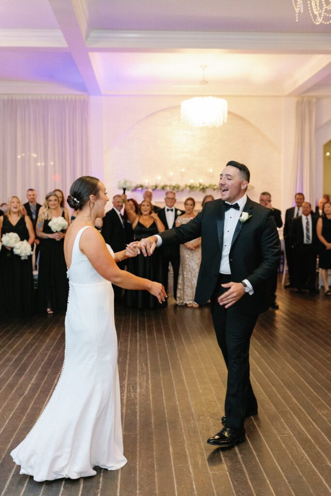 Bride and groom first dance on the dance floor during Newport wedding recpetion