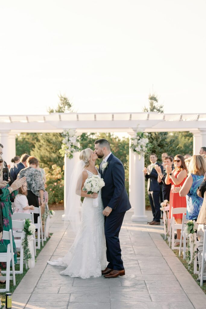 Bride and groom walking down the aisle as husband and wife