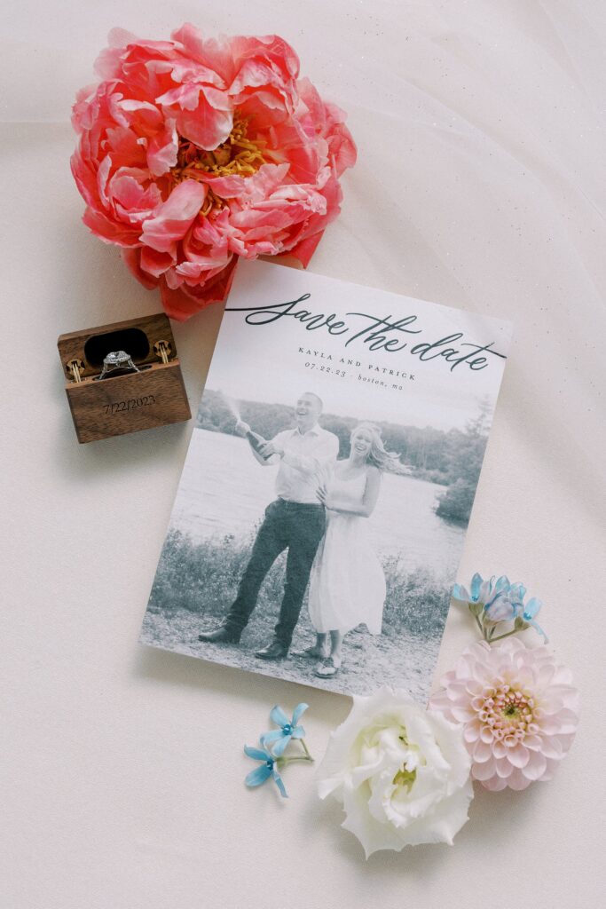 Invitation and engagement ring flat lay detail photography