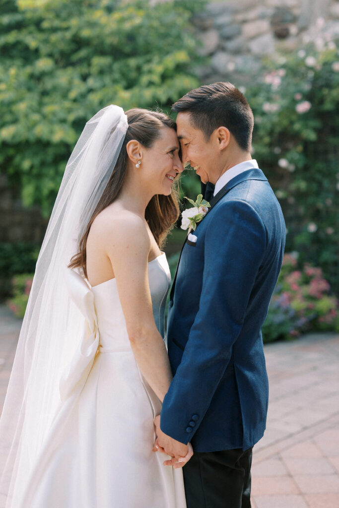 Bride and groom head touching portrait before wedding ceremony