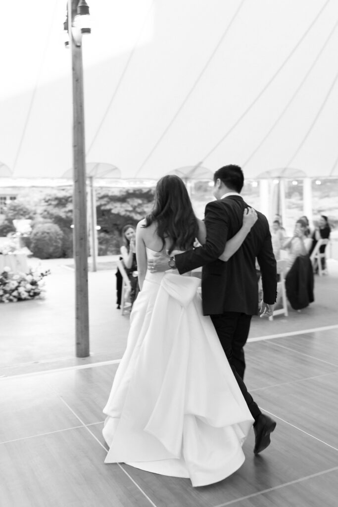 Black and white grainy candid photo of bride and groom