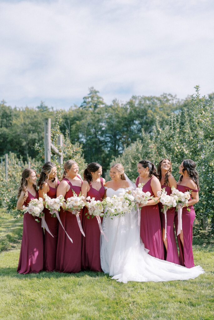 Bride and bridesmaids portrait in the orchard for The Greenery at McKenzie's Farm Wedding