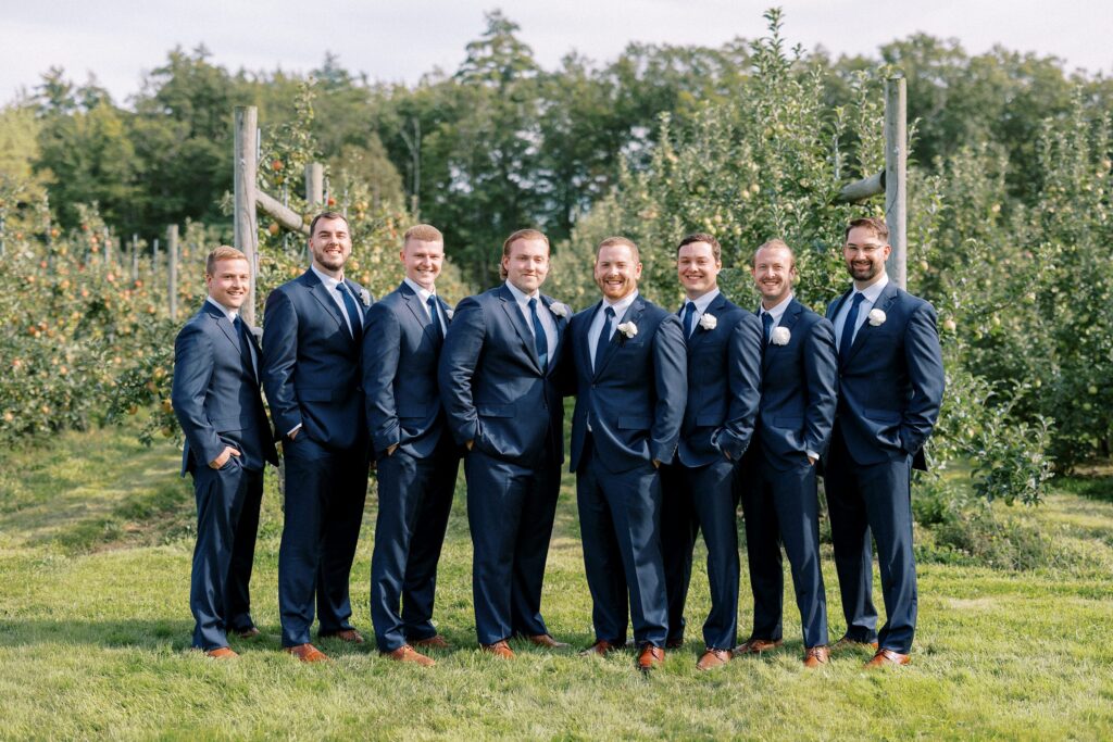 Groom and groomsmen portrait in the orchard at The Greenery at McKenzie's Farm Wedding