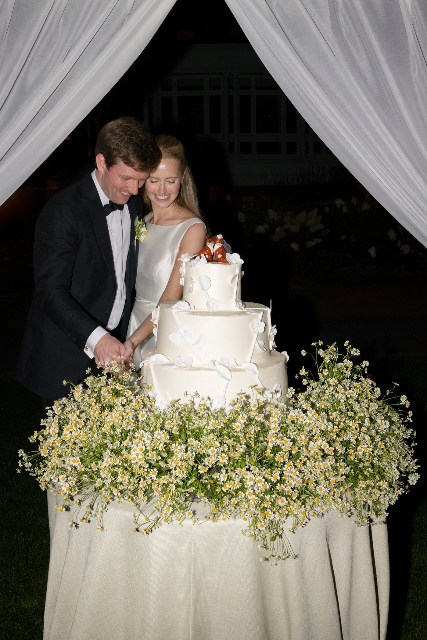 Bride and groom cutting their wedding cake