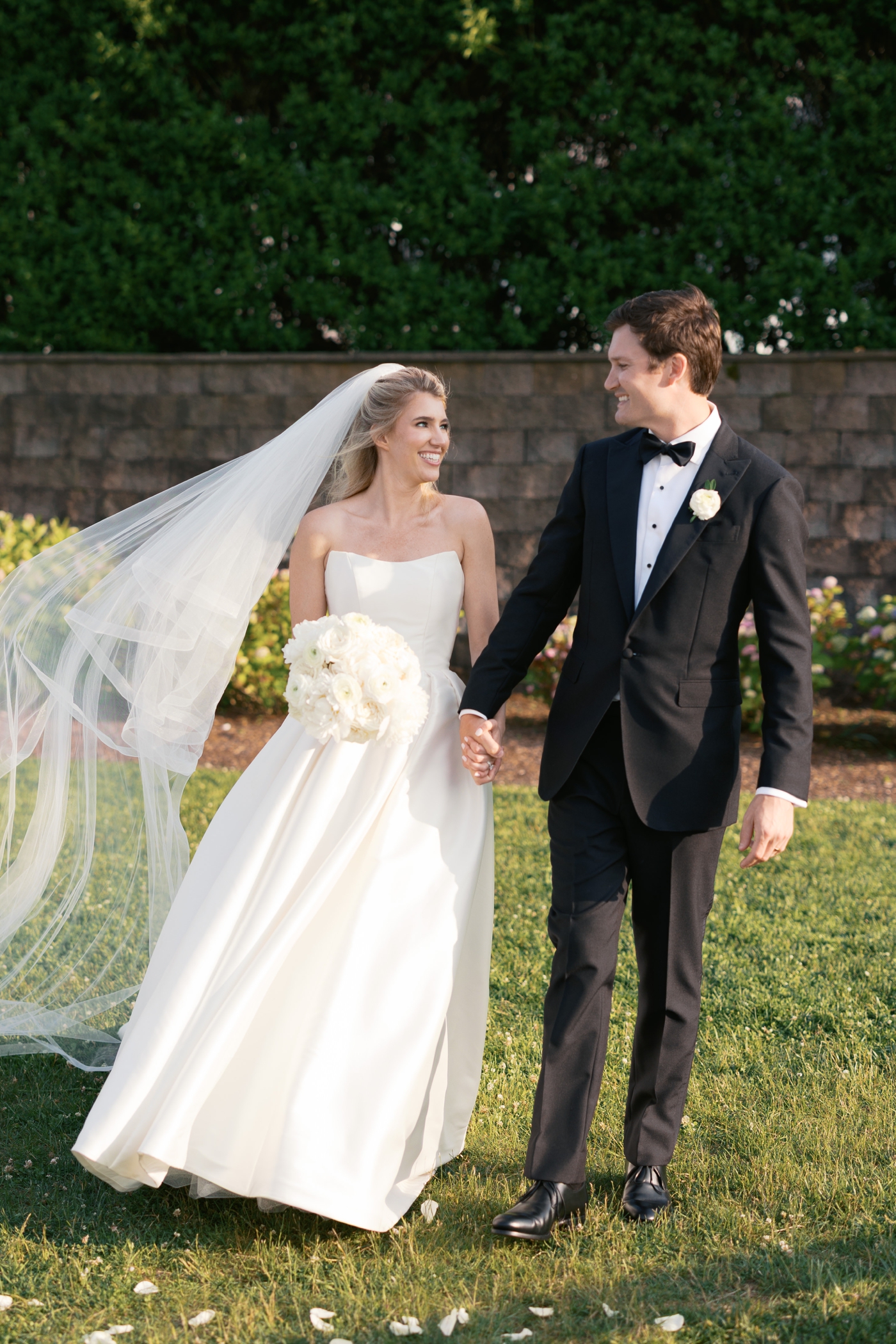 Bride and groom walking at Wychmere Beach Club