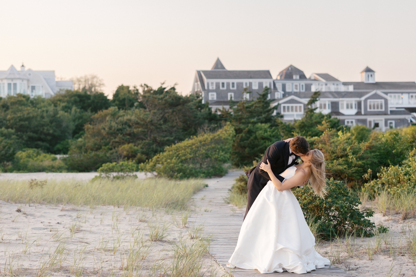 Groom dipping his bride for a kiss