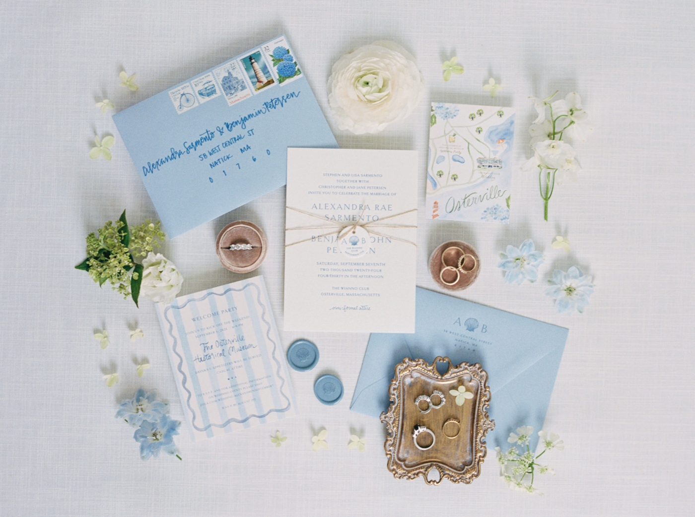 Flatlay of a blue and white coastal wedding invitation suite by Kara Weintraub