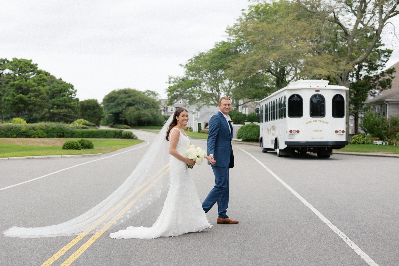 Bride and groom crossing the street